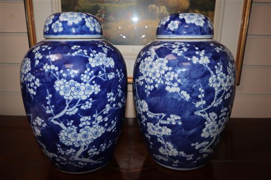 A pair of Chinese blue and white jars and covers, c.1900, Kangxi mark (one a.f.)